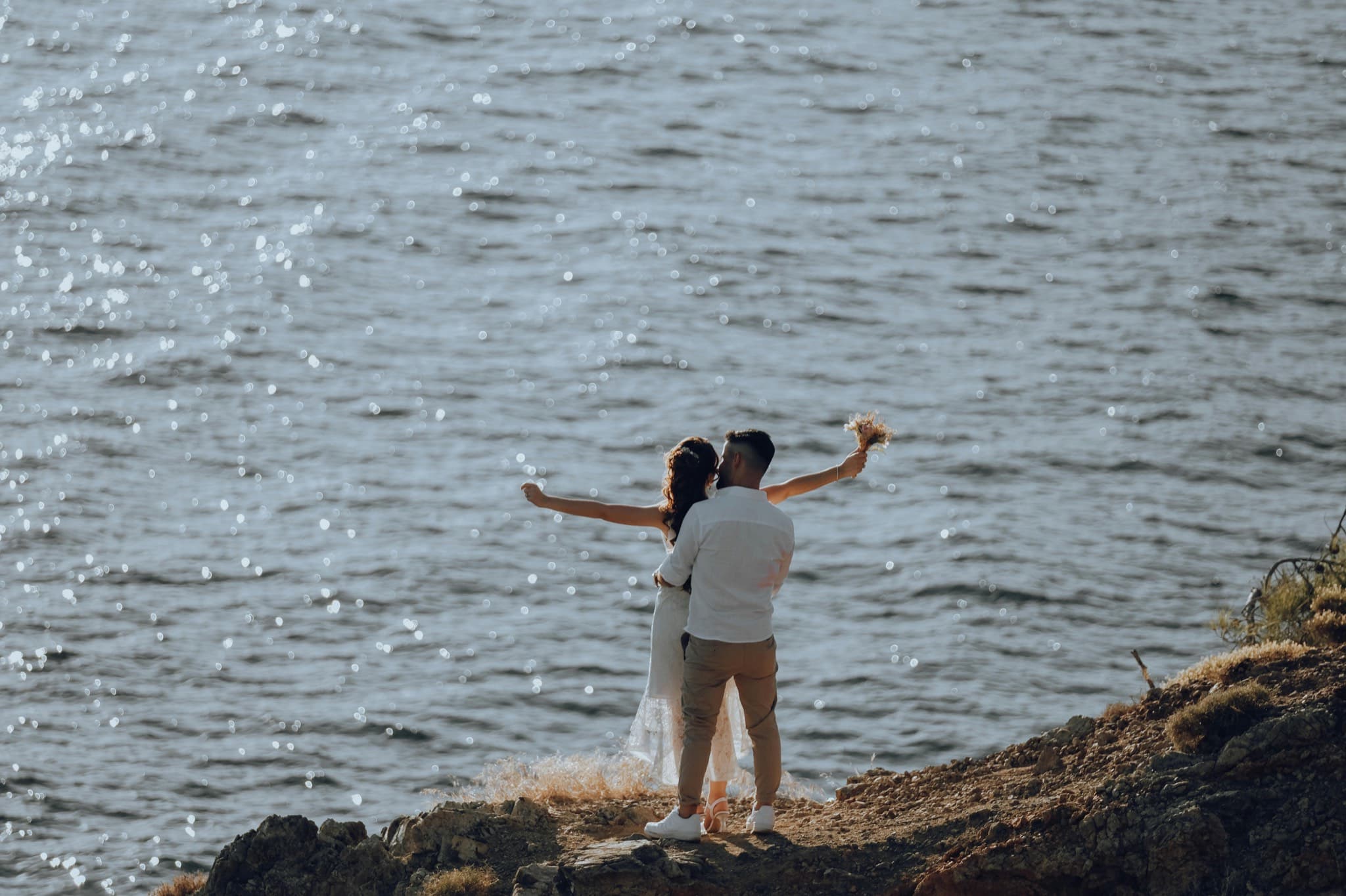 Couple embracing by the sea